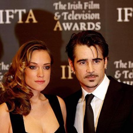 Colin Farrell and Alicja Bachleda-Curus at award show. 
